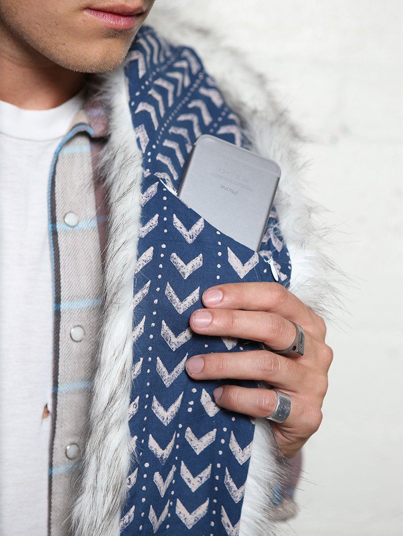 Man wearing faux fur Husky Arrows SpiritHood, front view 2