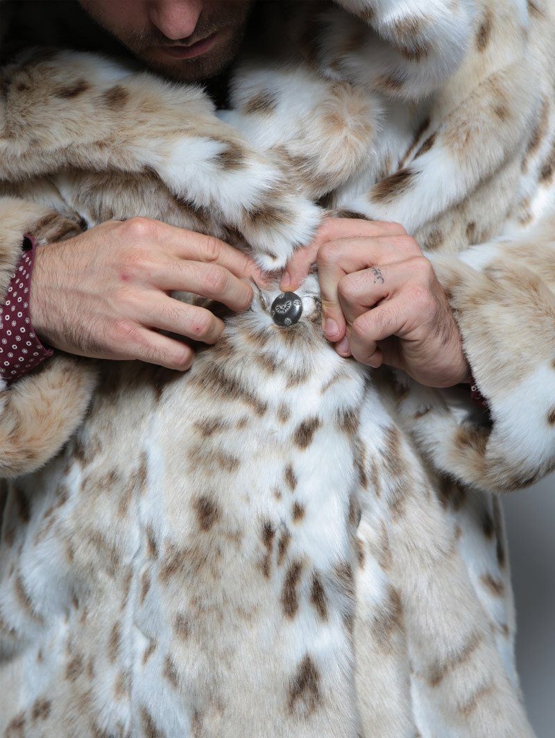 Close Up of Custom Logo Button on Siberian Snow Leopard Faux Fur Coat 