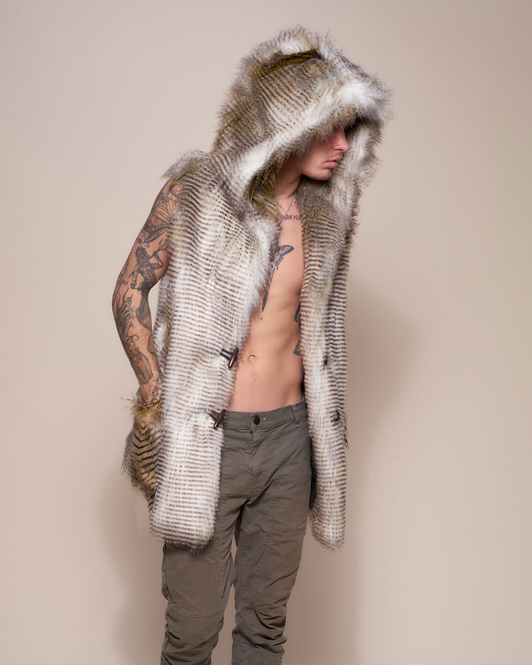 Man wearing Alaskan Hawk Hooded Faux Fur Vest, side view