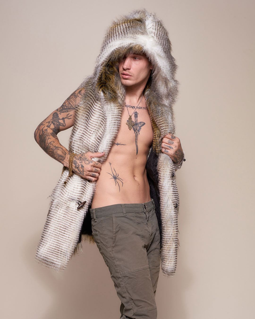 Man wearing Alaskan Hawk Hooded Faux Fur Vest, side view 1