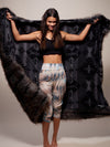 Female Holding Faux Fur Throw with Night Fox Design