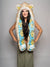 Woman wearing faux fur Golden Hamsa Bear Collector Edition SpiritHood, front view 2