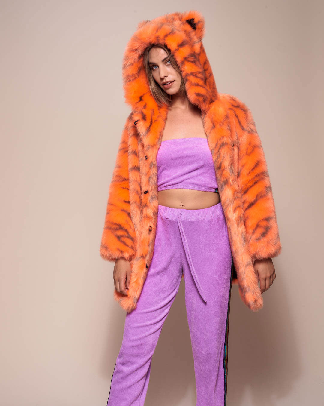 Woman wearing Neon Tiger Limited Edition Classic Faux Fur Coat, front view 1