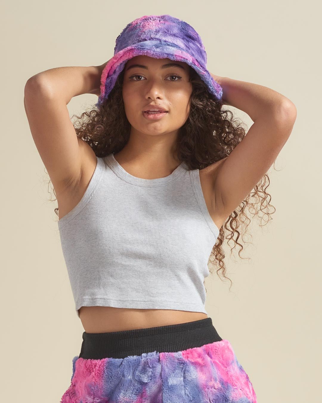 Woman Wearing Pink and Purple Cotton Candy Faux Fur Bucket Hat