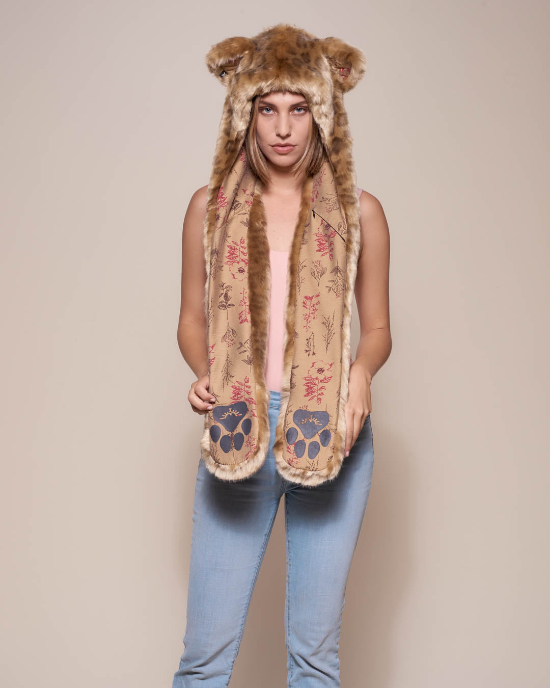 Woman wearing African Golden Cat Luxe Faux Fur Collector Edition Hood, front view 2