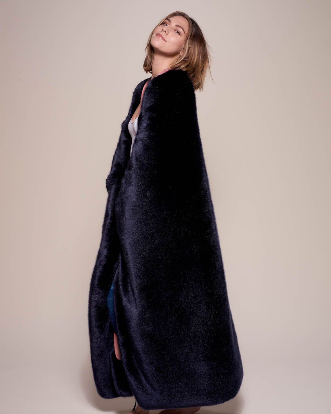 Female Wrapped in Collector Edition Indigo Wolf Luxe Faux Fur Throw