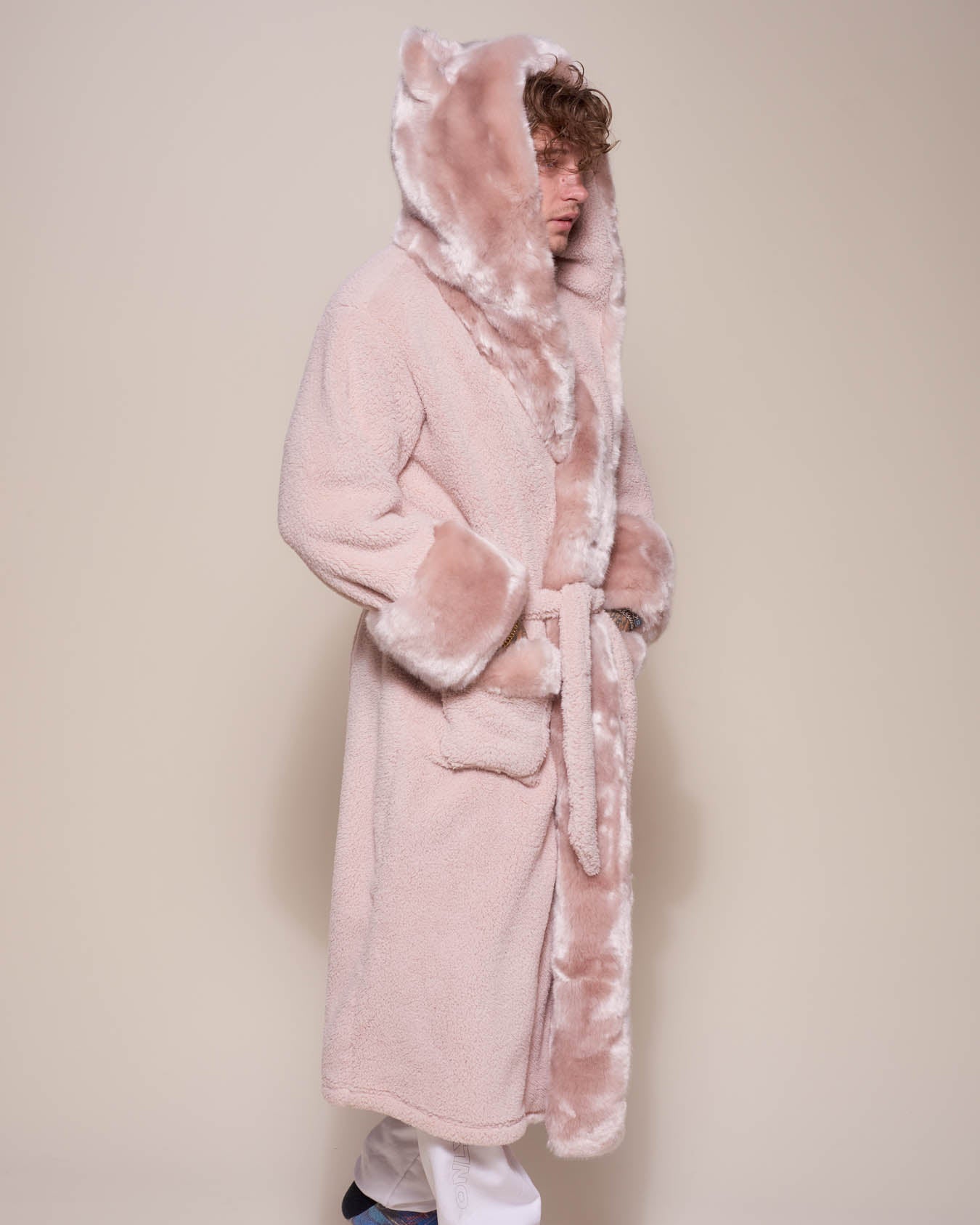Man wearing Rose Quartz Wolf Luxe Classic Faux Fur Robe, side view 1