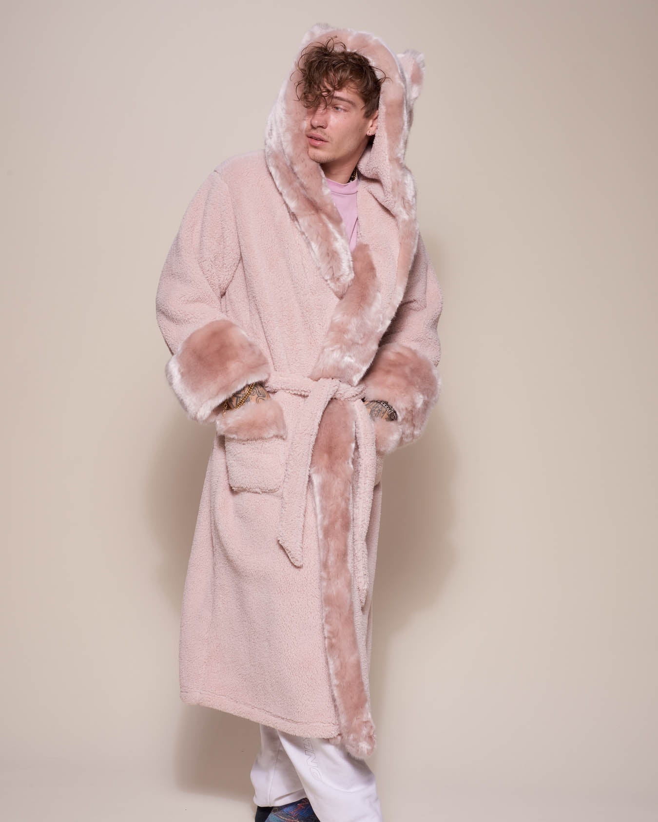 Man wearing Rose Quartz Wolf Luxe Classic Faux Fur Robe, side view 2