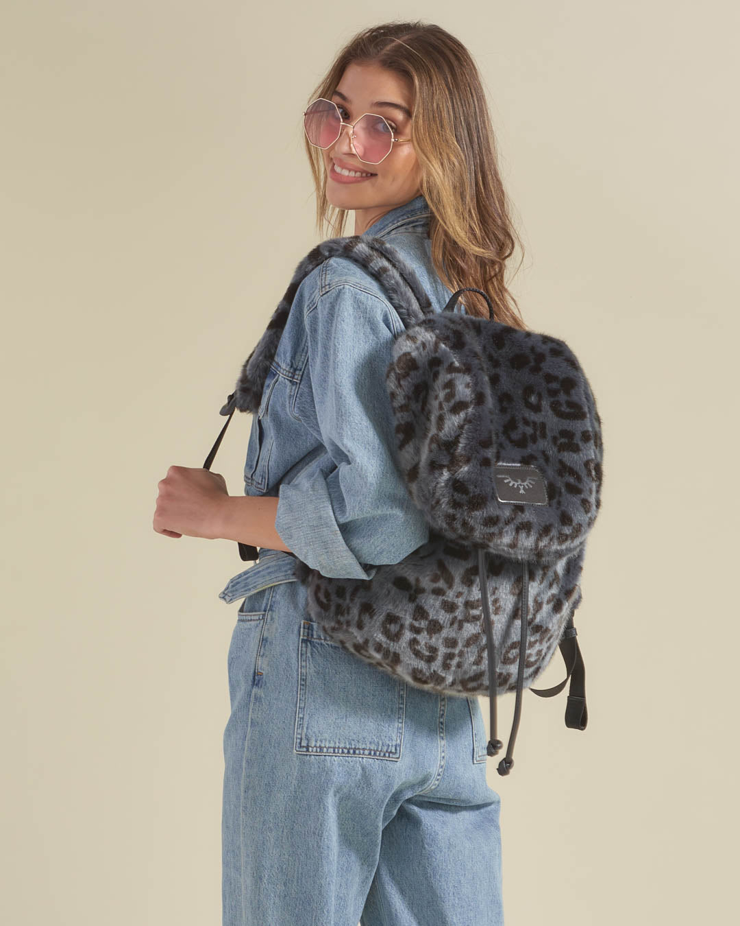 Woman Wearing Slate Leopard Faux Fur Backpack