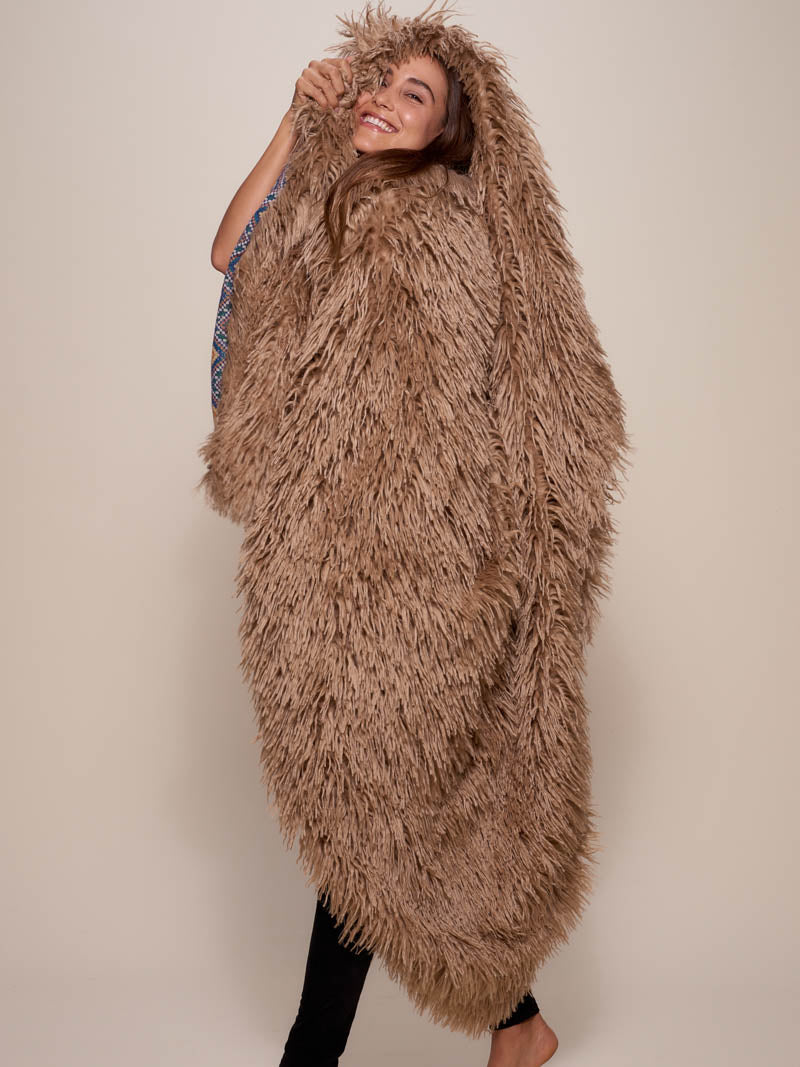Woman wrapped Alpaca Faux Fur Throw, side view 1