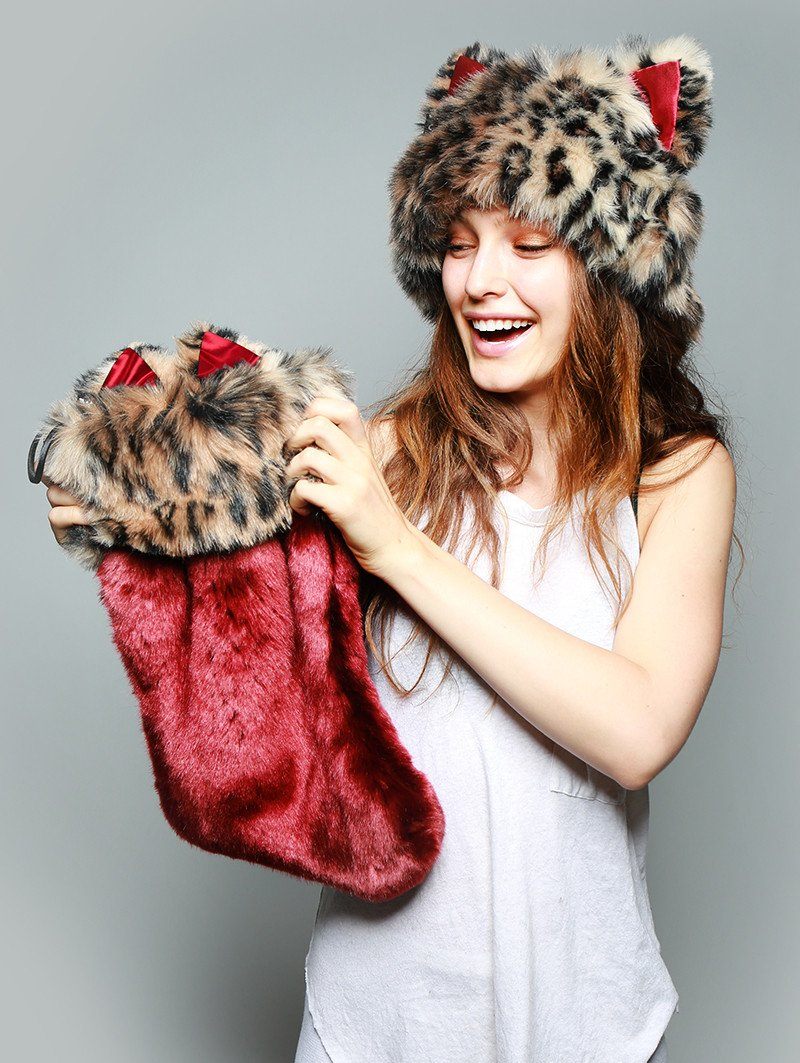 Women holding faux fur stocking and wearing faux fur hood, view 3