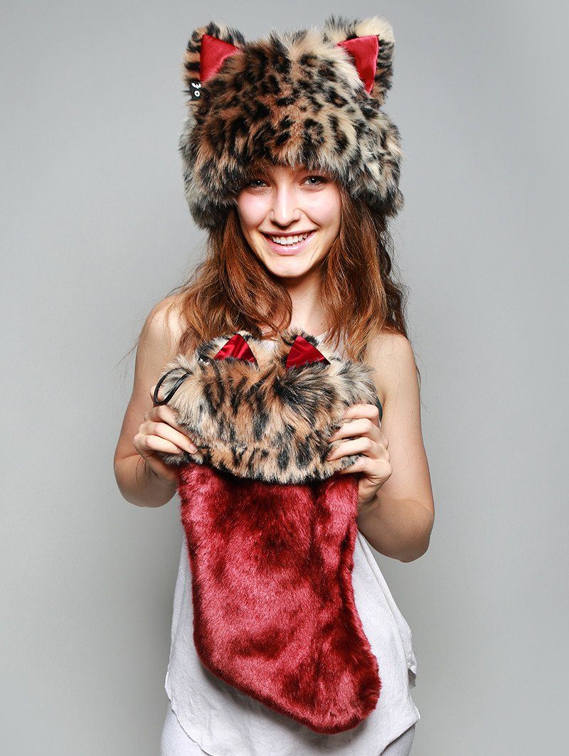 Woman holding faux fur Howliday Feline Spirit Stocking, front view 2