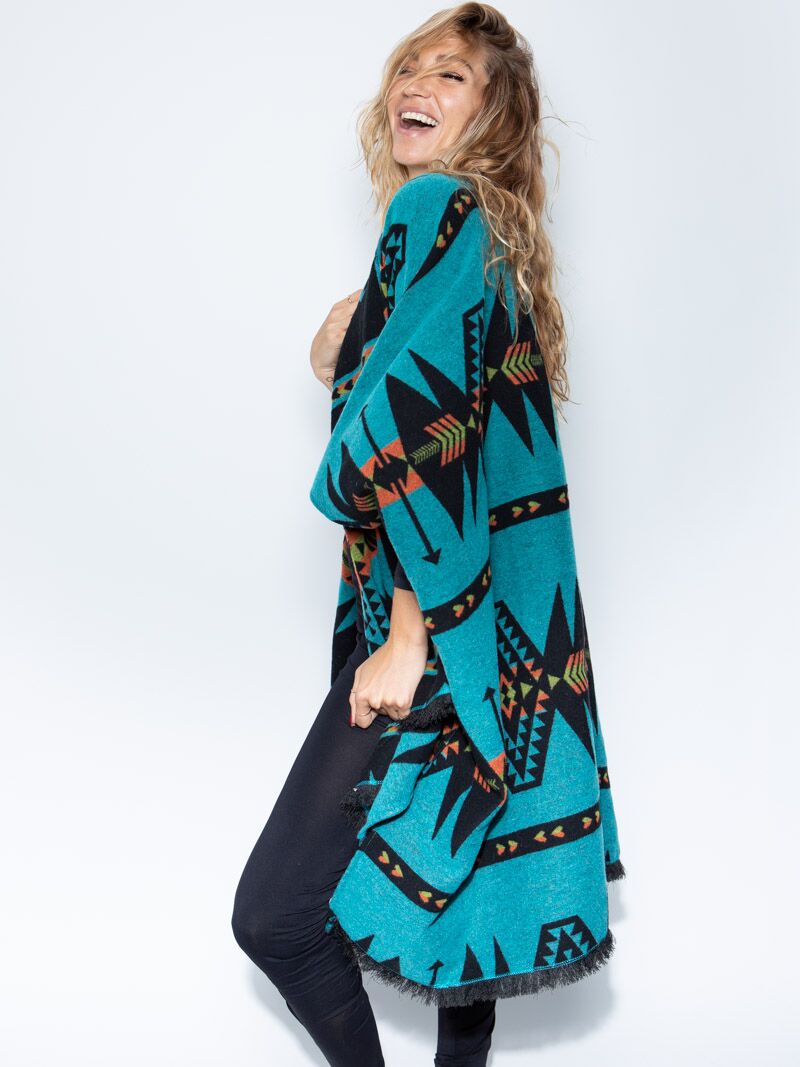 Woman wearing Grey Wolf Fabric Poncho, side view 1