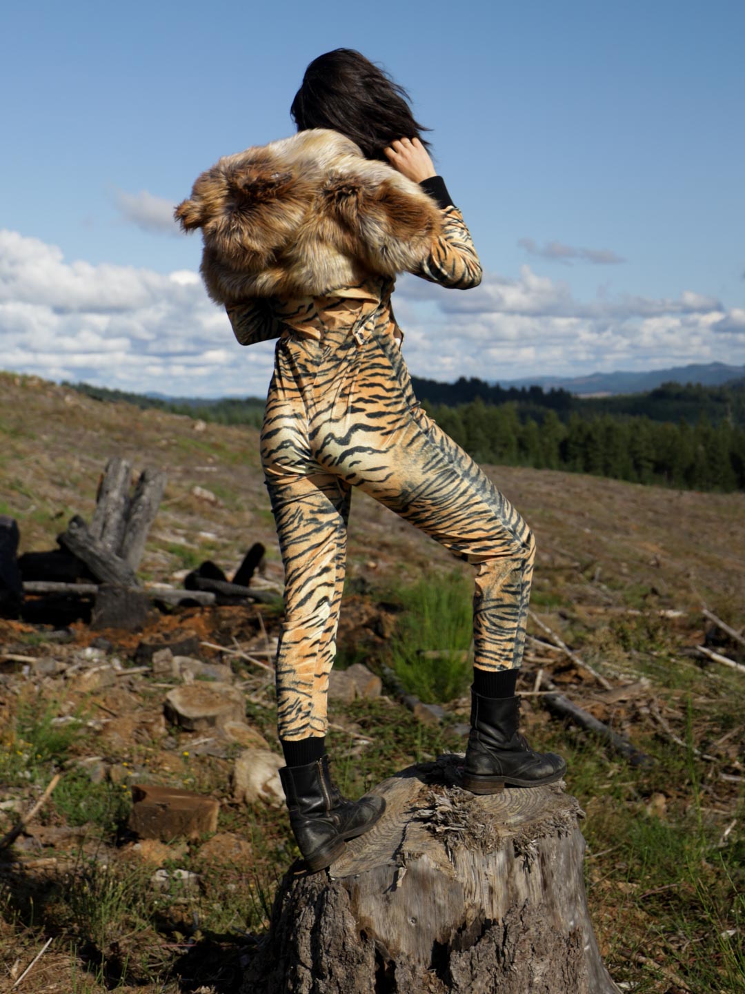 Woman wearing Liger Velvet Classic Faux Fur Animal Onesie, side view 1
