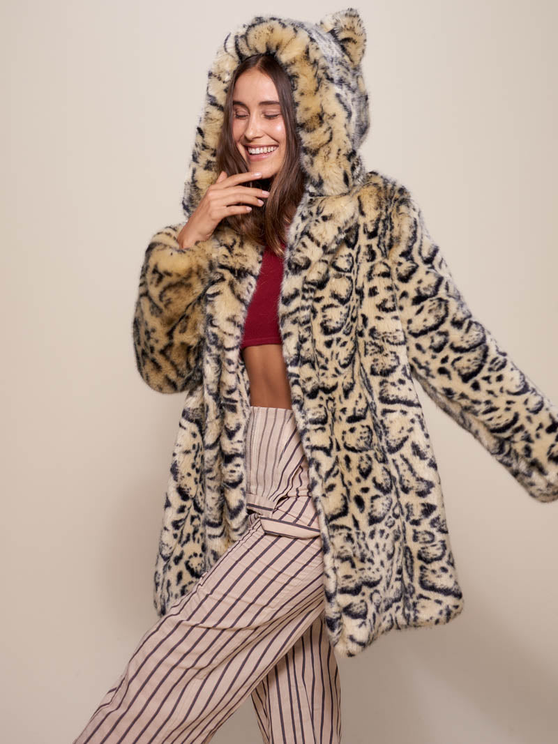 Woman wearing Classic Ocelot Luxe Faux Fur SpiritHood Coat, side view 1