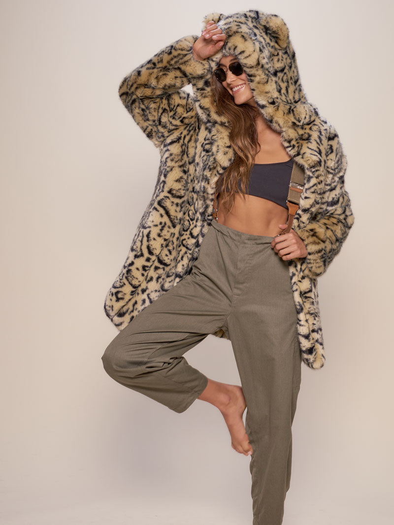 Woman wearing Classic Ocelot Luxe Faux Fur SpiritHood Coat, front view 1