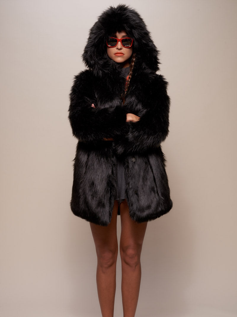 Woman in Sunglasses Crossing Her Arms While Wearing Black Wolf Hooded Faux Fur Coat