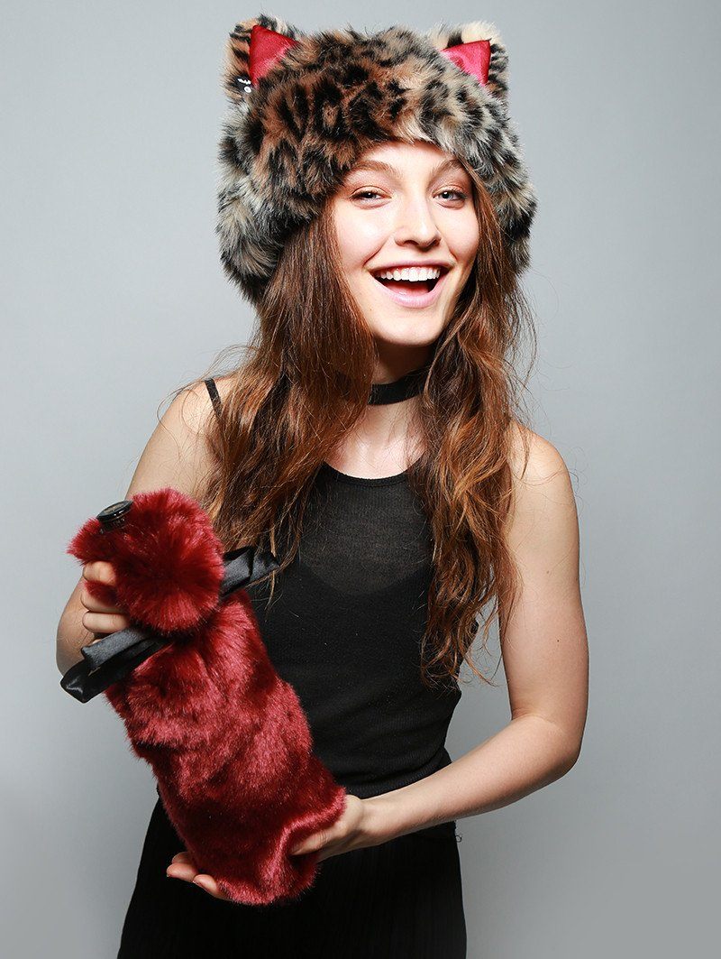 Women holding faux fur drink holder and wearing faux fur hood, view 1