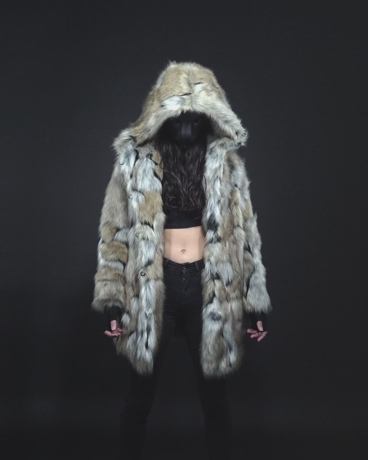 Video of Model in Mask Displaying Features of the Wolverine Hooded Faux Fur Coat for Women