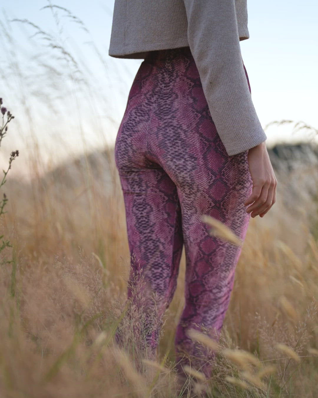 Pink Python High-Waisted Velvet Leggings on Woman in Action