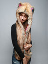 Woman wearing faux fur Flying Fox Collector SpiritHood, side view 1