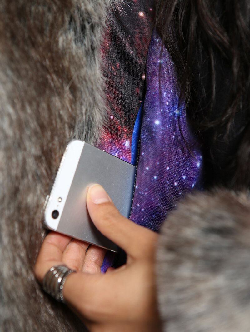 Woman wearing faux fur BlackMilk Galaxy Grey Wolf Coat, close view
