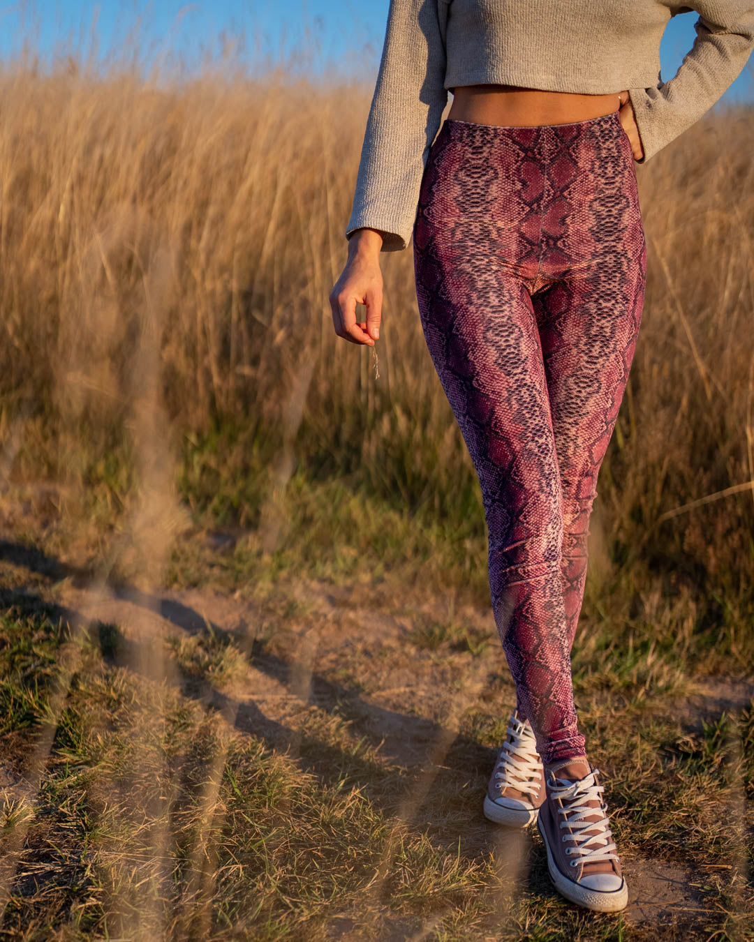 Pink Python High-Waisted Velvet Leggings on Woman