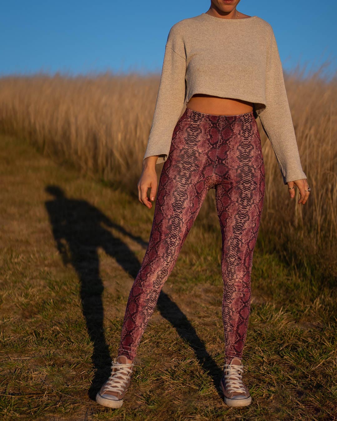 Woman Wearing Pink Python High-Waisted Velvet Leggings